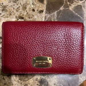 Red Michael Kors bifold wallet